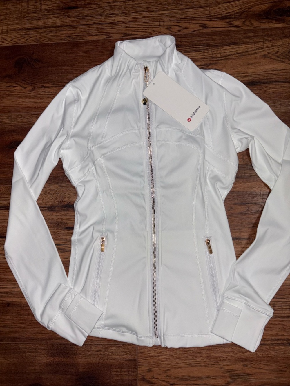 Lulu Define Jacket Size 4 White with Golden zippers.